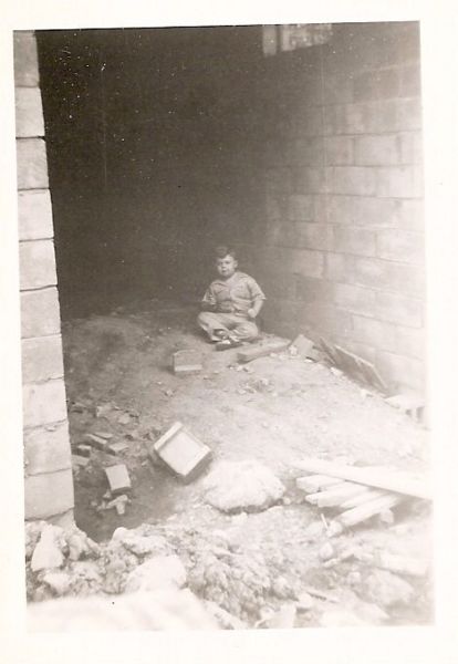 File:John Eld playing in house on Valera Street.jpg